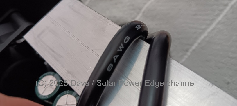 The silicone jacketed negative cables wrapping over the heat sink